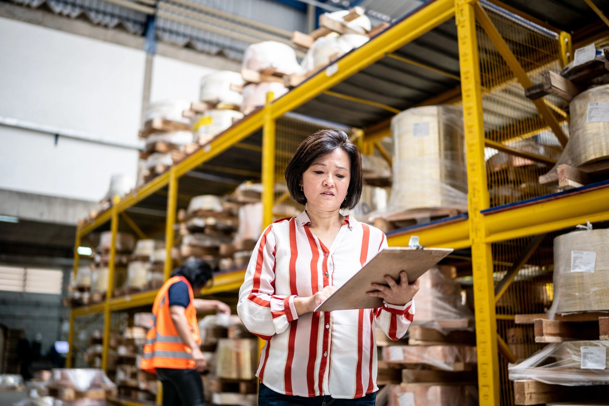 Professional taking inventory in an industrial facility