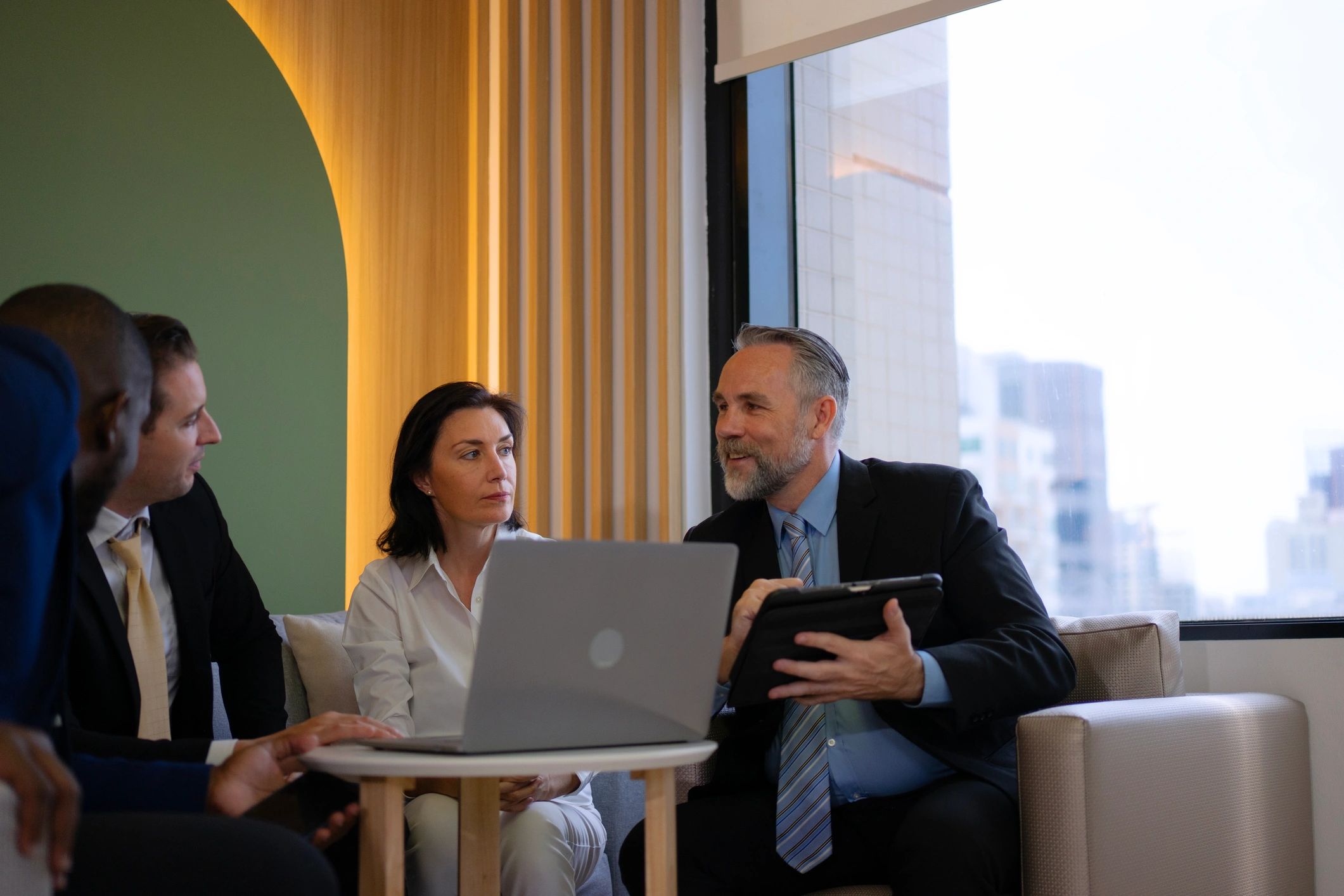 Advisory professionals meeting in an office environment