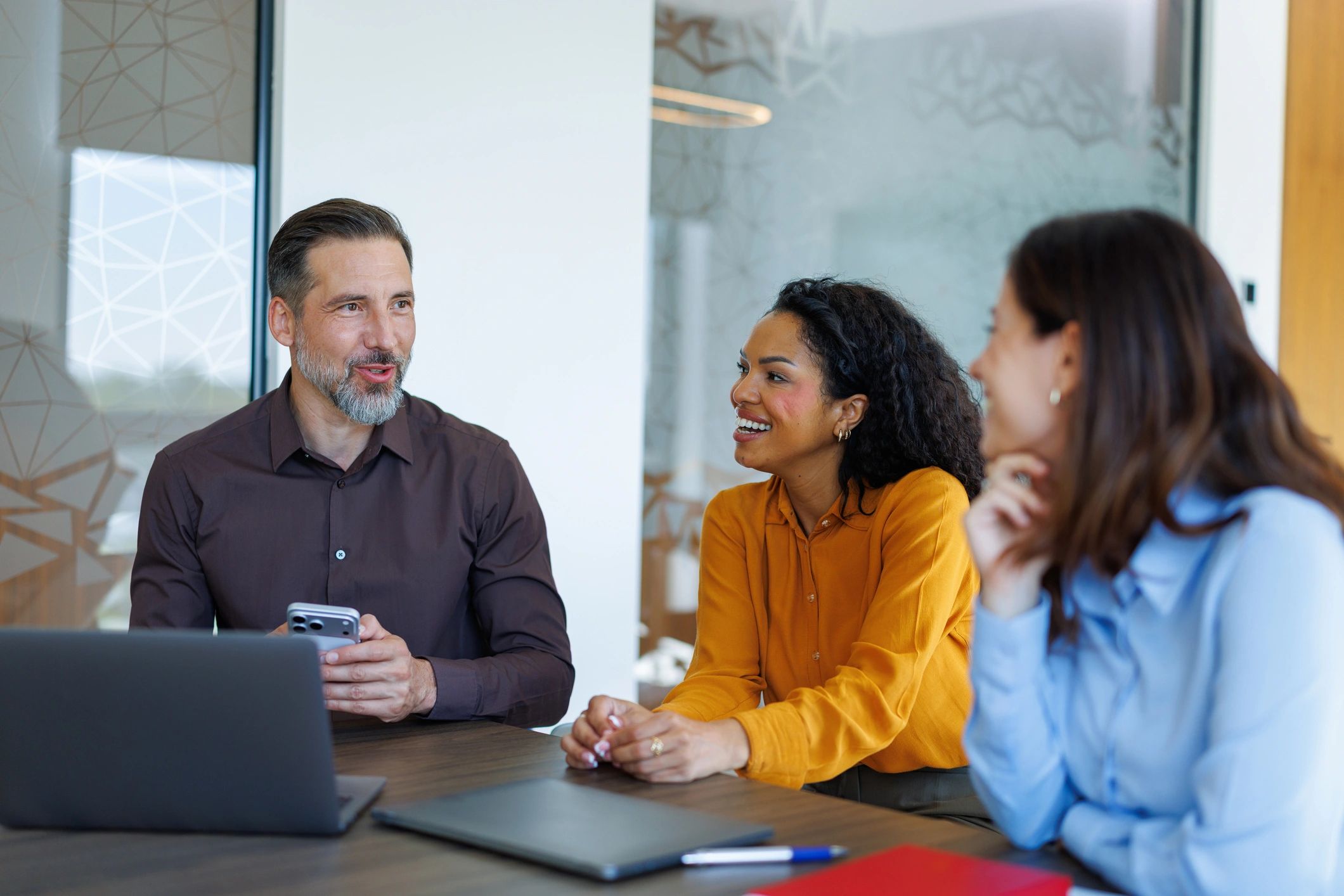 Consulting team in discussion during a strategy meeting